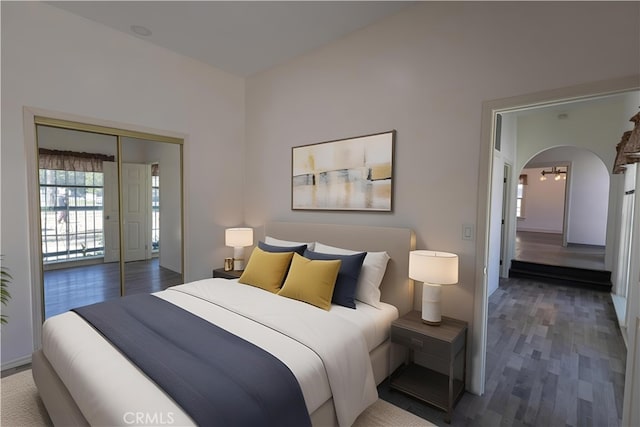 425 W 17th St, San Bernardino, CA 92405 - bedroom featuring wood finished floors, arched walkways, and a closet