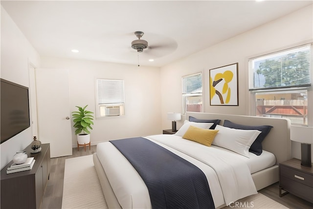425 W 17th St, San Bernardino, CA 92405 - bedroom with light wood finished floors, recessed lighting, cooling unit, and a ceiling fan