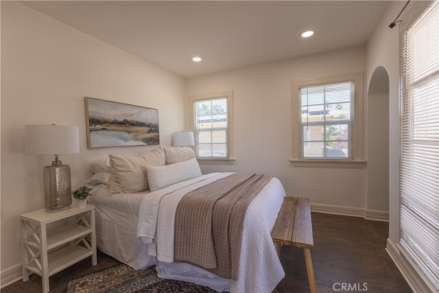 425 W 17th St, San Bernardino, CA 92405 - bedroom featuring wood finished floors, multiple windows, recessed lighting, and arched walkways