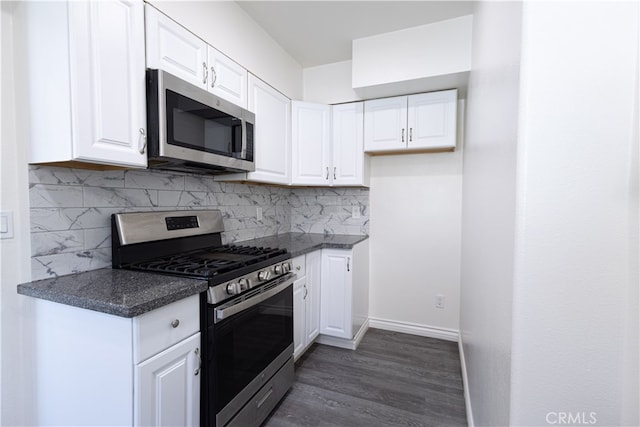 425 W 17th St, San Bernardino, CA 92405 - kitchen with stainless steel appliances, white cabinets, backsplash, and dark wood finished floors