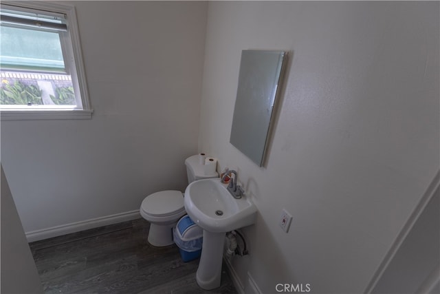 425 W 17th St, San Bernardino, CA 92405 - bathroom featuring wood finished floors and toilet