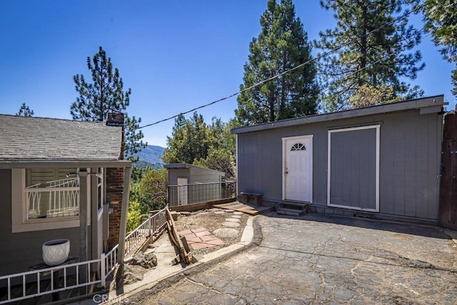 35853 Sierra Linda Dr, Wishon, CA 93669 - view of patio / terrace featuring a mountain view, an outdoor structure, and entry steps