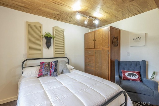 35853 Sierra Linda Dr, Wishon, CA 93669 - bedroom featuring wood ceiling, wood finished floors, and track lighting