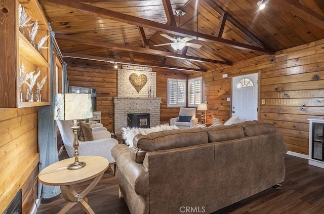 35853 Sierra Linda Dr, Wishon, CA 93669 - living area featuring wooden walls, dark wood-style flooring, wood ceiling, a ceiling fan, and a fireplace
