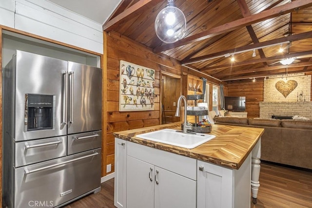 35853 Sierra Linda Dr, Wishon, CA 93669 - kitchen with high end refrigerator, wooden counters, wooden walls, dark wood-style flooring, and open floor plan