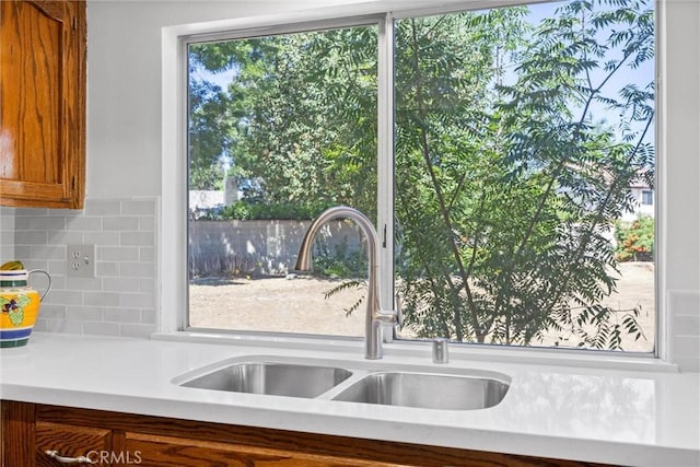 601 Las Arenas Ct, Bakersfield, CA 93314 - kitchen with light countertops, tasteful backsplash, and brown cabinetry