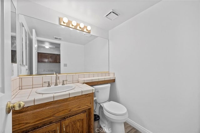 601 Las Arenas Ct, Bakersfield, CA 93314 - half bath with vanity and wood finished floors
