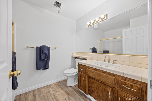 601 Las Arenas Ct, Bakersfield, CA 93314 - full bath featuring vanity, wood finished floors, and a shower with shower door