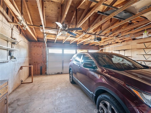 17911 Juniper St, Hesperia, CA 92345 - garage with a garage door opener and a ceiling fan
