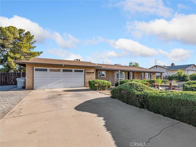 17911 Juniper St, Hesperia, CA 92345 - ranch-style home featuring driveway, an attached garage, and stucco siding