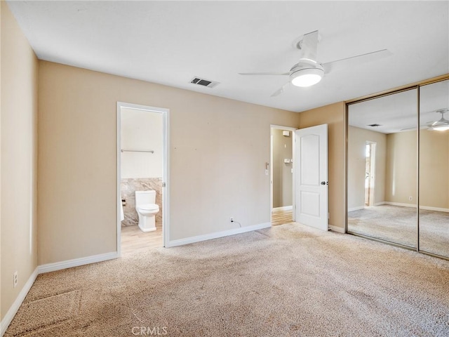17911 Juniper St, Hesperia, CA 92345 - unfurnished bedroom featuring carpet, a closet, ensuite bath, and a ceiling fan