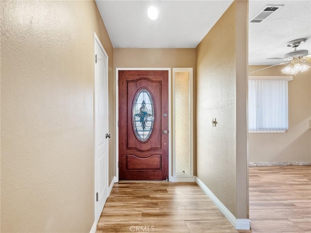 17911 Juniper St, Hesperia, CA 92345 - entrance foyer featuring a textured wall, light wood-style floors, and a ceiling fan