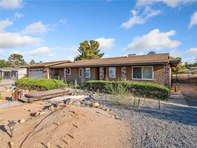 17911 Juniper St, Hesperia, CA 92345 - single story home with a garage and stone siding