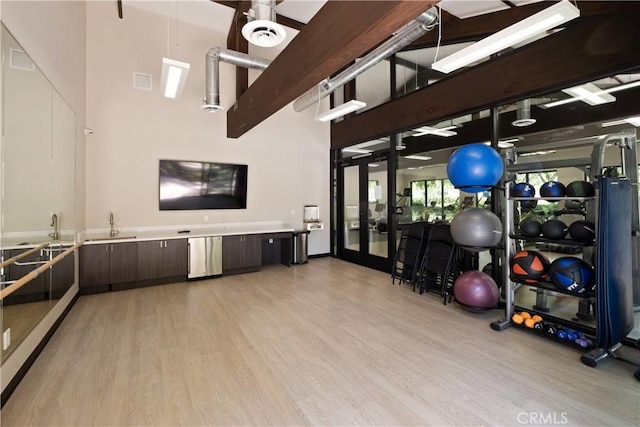 14 Tall Oak, Irvine, CA 92603 - exercise room featuring light wood-type flooring, a high ceiling, and french doors