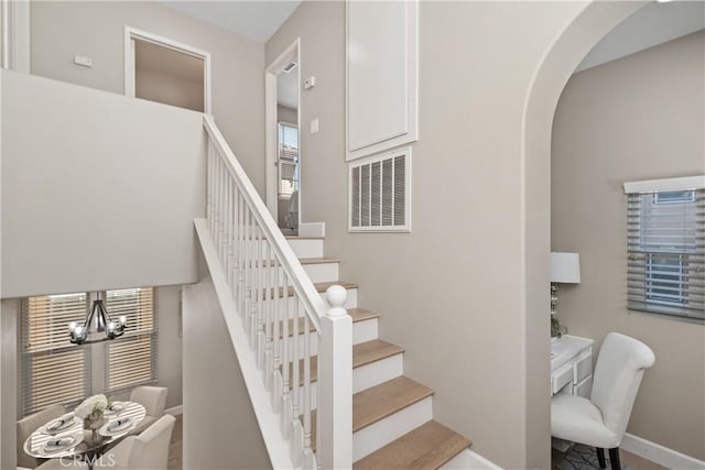 14 Tall Oak, Irvine, CA 92603 - staircase with a chandelier and arched walkways