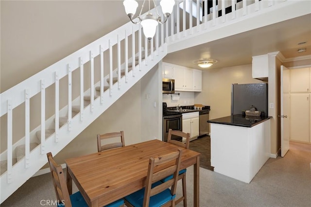 603 S Prospect Ave Unit 305, Redondo Beach, CA 90277 - dining area featuring a chandelier and carpet flooring