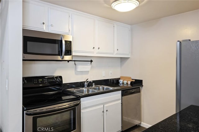 603 S Prospect Ave Unit 305, Redondo Beach, CA 90277 - kitchen with appliances with stainless steel finishes and white cabinetry