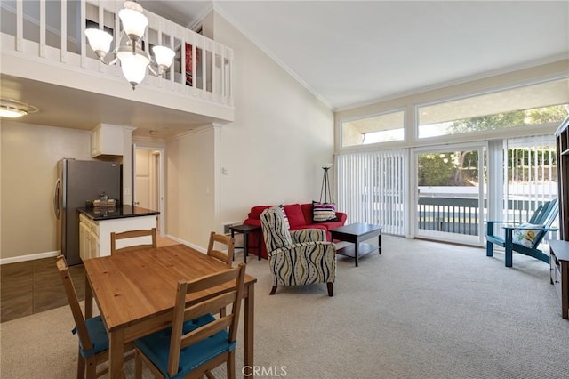 603 S Prospect Ave Unit 305, Redondo Beach, CA 90277 - carpeted dining area featuring a chandelier, crown molding, and high vaulted ceiling