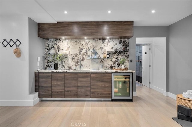 4764 Browndeer Ln, Rancho Palos Verdes, CA 90275 - indoor wet bar with wine cooler, light wood-style flooring, decorative backsplash, and recessed lighting
