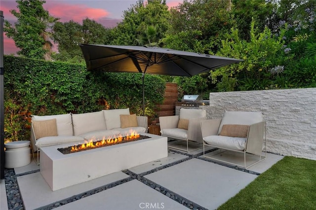 4764 Browndeer Ln, Rancho Palos Verdes, CA 90275 - patio terrace at dusk with an outdoor fire pit, a patio, and an outdoor kitchen
