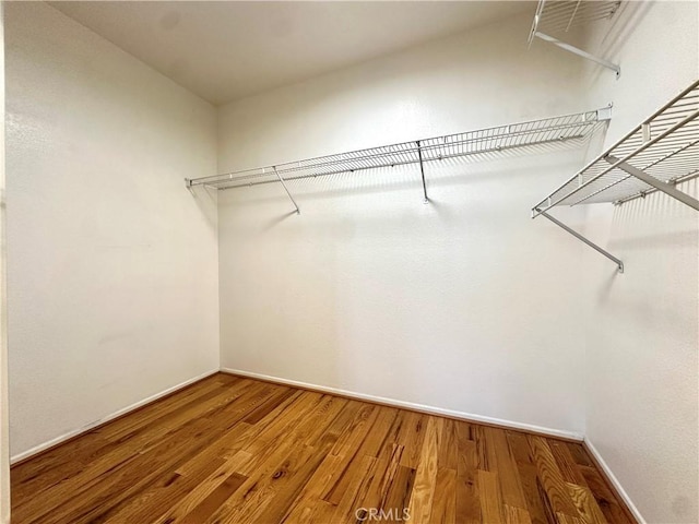 2244 Posada Ct, Corona, CA 92879 - spacious closet featuring wood finished floors