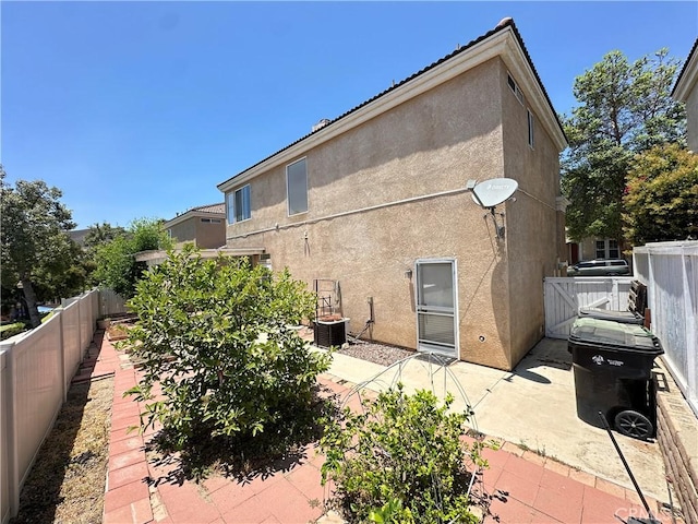 2244 Posada Ct, Corona, CA 92879 - back of property with a patio area and stucco siding
