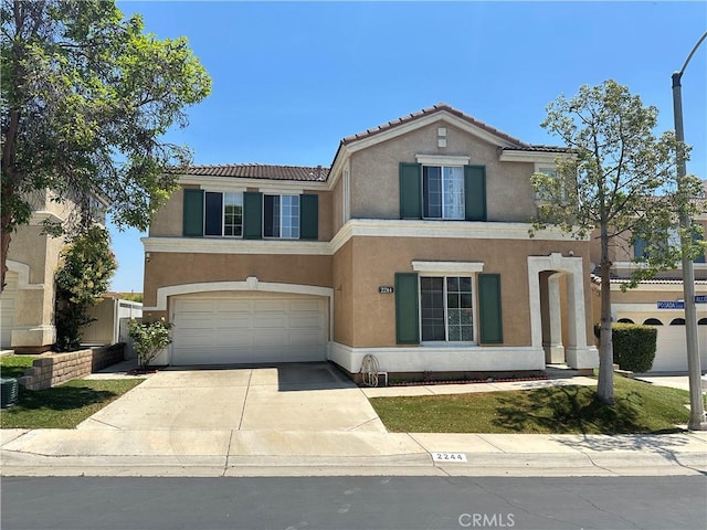 2244 Posada Ct, Corona, CA 92879 - view of front of home featuring stucco siding, a garage, a tile roof, and driveway