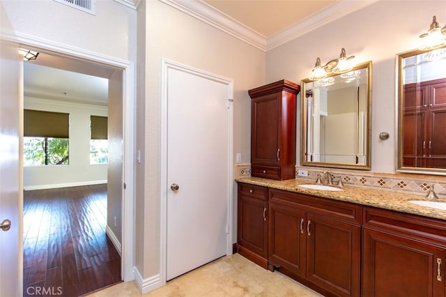 2567 Plaza Del Amo Unit 205, Torrance, CA 90503 - full bath featuring double vanity, crown molding, wood finished floors, and backsplash