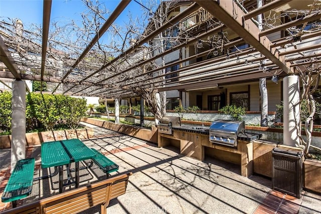 2567 Plaza Del Amo Unit 205, Torrance, CA 90503 - view of patio featuring an outdoor kitchen and a pergola