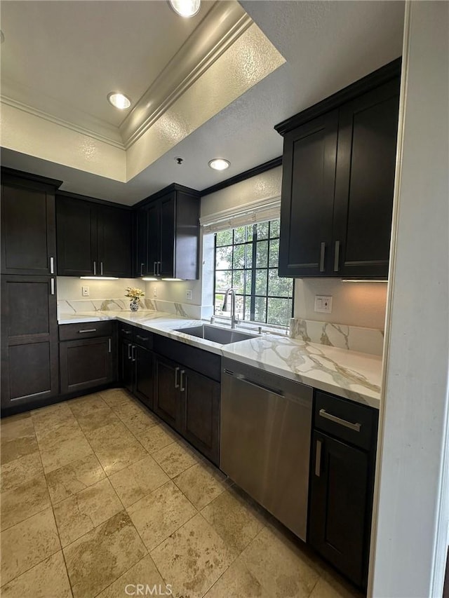 2567 Plaza Del Amo Unit 205, Torrance, CA 90503 - kitchen featuring stainless steel dishwasher, crown molding, a raised ceiling, dark cabinetry, and light stone countertops