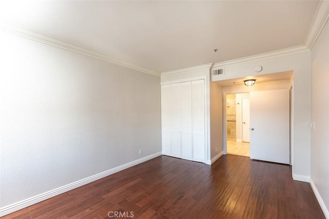2567 Plaza Del Amo Unit 205, Torrance, CA 90503 - unfurnished bedroom featuring dark wood finished floors, a closet, and crown molding