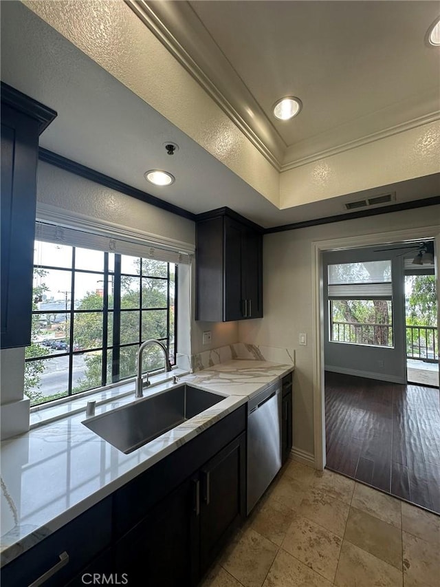 2567 Plaza Del Amo Unit 205, Torrance, CA 90503 - kitchen featuring dishwasher, crown molding, light stone countertops, a raised ceiling, and dark cabinetry