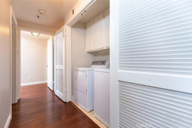 2567 Plaza Del Amo Unit 205, Torrance, CA 90503 - washroom featuring cabinet space, washer and dryer, and light wood-type flooring