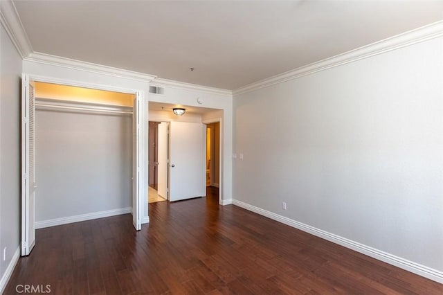 2567 Plaza Del Amo Unit 205, Torrance, CA 90503 - unfurnished bedroom featuring dark wood finished floors, ornamental molding, and a closet