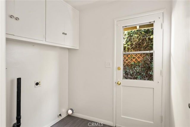 557 S Gardner Dr, Orange, CA 92866 - laundry area featuring electric dryer hookup, cabinet space, and dark wood finished floors