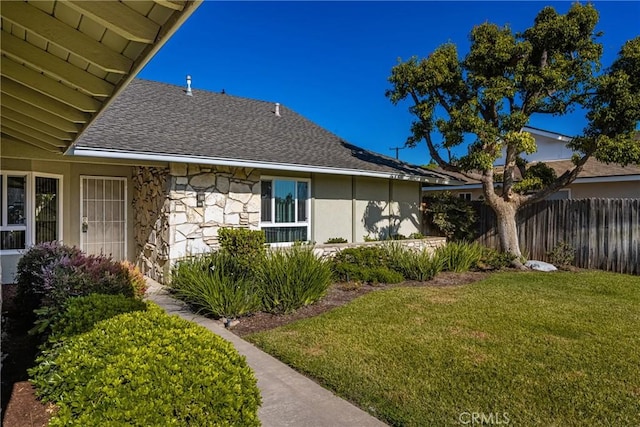 557 S Gardner Dr, Orange, CA 92866 - view of home's exterior with stone siding and roof with shingles