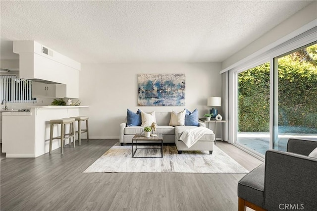 557 S Gardner Dr, Orange, CA 92866 - living area featuring wood finished floors and a textured ceiling