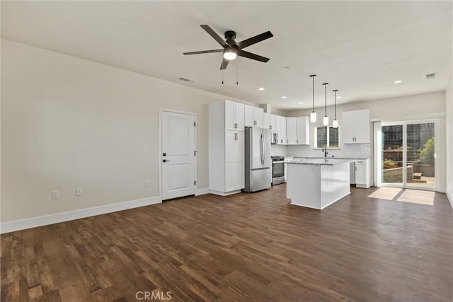 5616 Glen Way, Paradise, CA 95969 - kitchen featuring appliances with stainless steel finishes, open floor plan, a kitchen island, and recessed lighting
