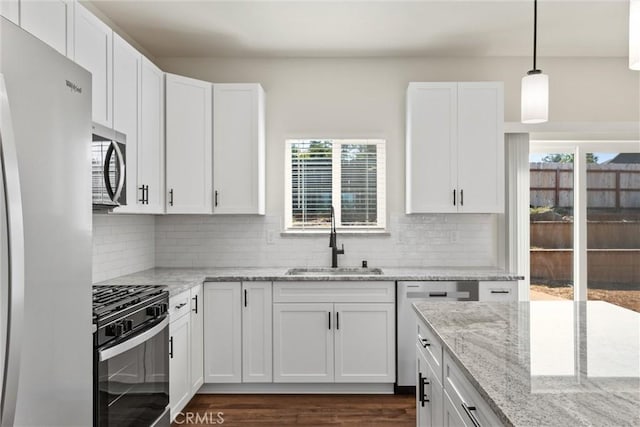 5616 Glen Way, Paradise, CA 95969 - kitchen with stainless steel appliances, healthy amount of natural light, and white cabinetry