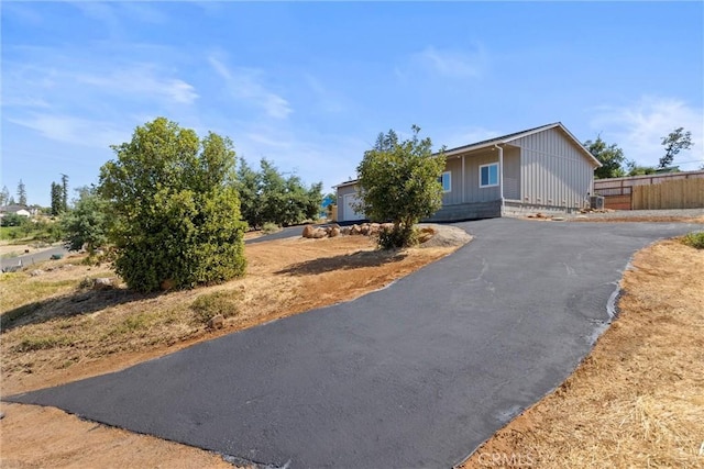 5616 Glen Way, Paradise, CA 95969 - view of front of property with board and batten siding and driveway