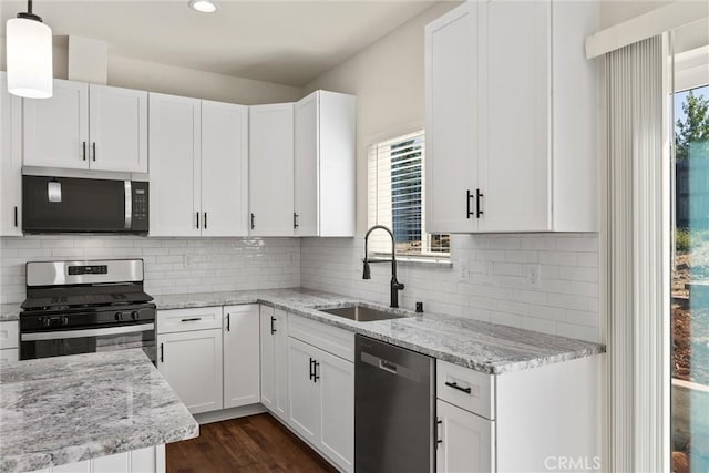 5616 Glen Way, Paradise, CA 95969 - kitchen featuring appliances with stainless steel finishes, white cabinetry, light stone countertops, and recessed lighting