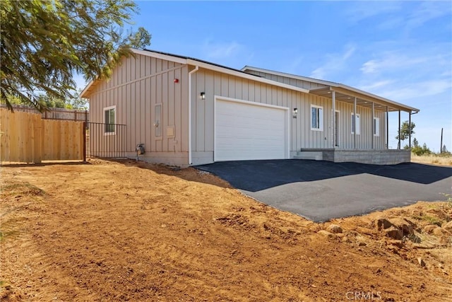 5616 Glen Way, Paradise, CA 95969 - view of front of property featuring board and batten siding, a garage, and driveway