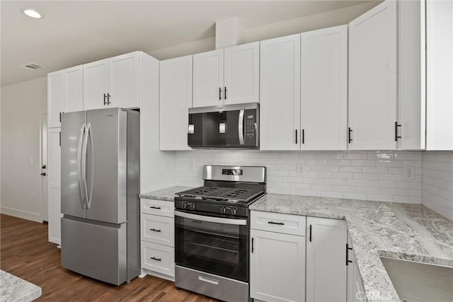 5616 Glen Way, Paradise, CA 95969 - kitchen featuring stainless steel appliances, white cabinetry, dark wood-type flooring, and recessed lighting