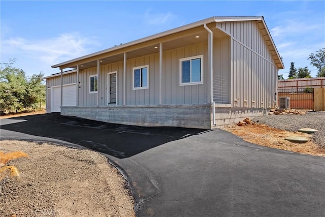 5616 Glen Way, Paradise, CA 95969 - view of front of home featuring board and batten siding, a garage, and driveway