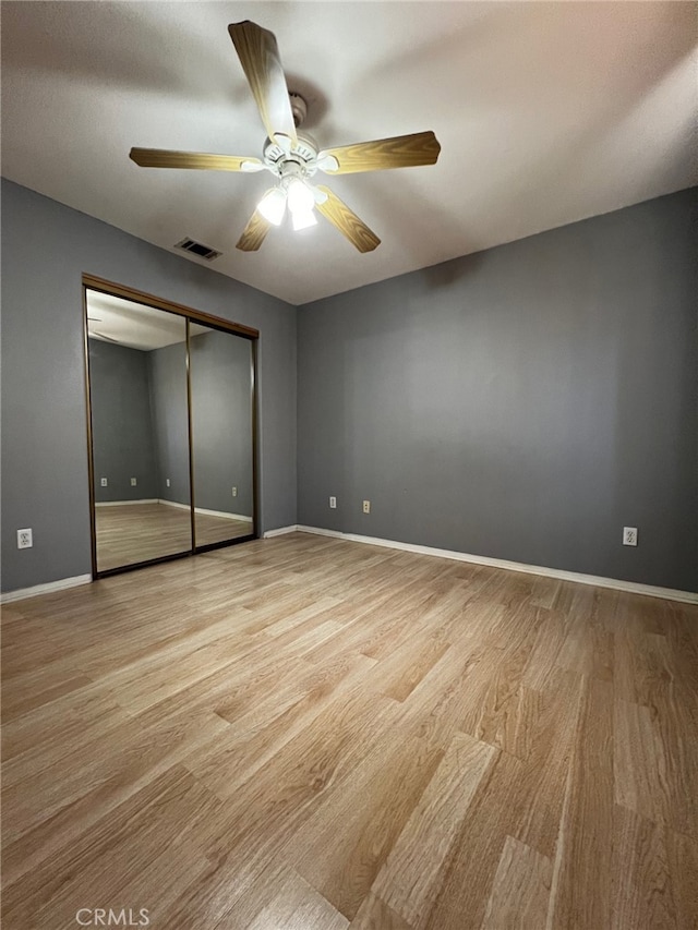 2932 Prospect Ave, Riverside, CA 92507 - unfurnished bedroom with light wood-style flooring, a closet, and a ceiling fan