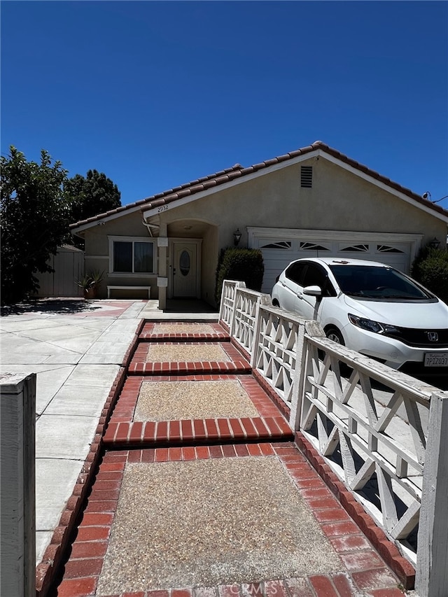 2932 Prospect Ave, Riverside, CA 92507 - view of front facade featuring a garage and stucco siding
