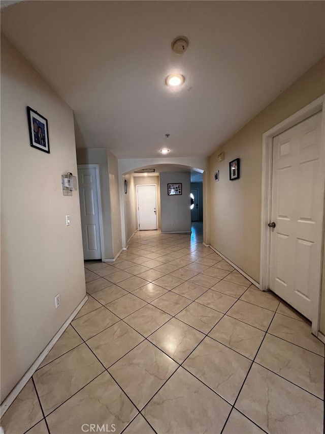 2932 Prospect Ave, Riverside, CA 92507 - corridor featuring arched walkways and light tile patterned flooring