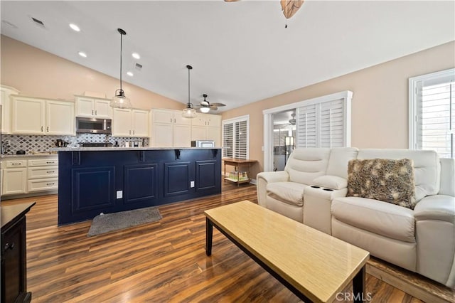 3310 Purple Sage Ln, Palmdale, CA 93550 - living area featuring ceiling fan, lofted ceiling, dark wood finished floors, and recessed lighting