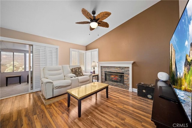 3310 Purple Sage Ln, Palmdale, CA 93550 - living area featuring a ceiling fan, wood finished floors, a fireplace, and high vaulted ceiling
