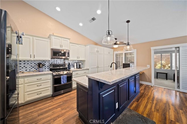 3310 Purple Sage Ln, Palmdale, CA 93550 - kitchen with appliances with stainless steel finishes, ceiling fan, lofted ceiling, white cabinetry, and backsplash